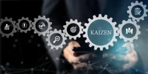 Representação do conceito Kaizen com engrenagens simbolizando melhoria contínua, eficiência e inovação nos processos empresariais.